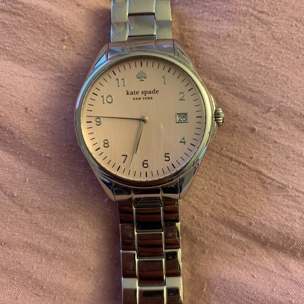 Kate Spade light pink face watch with silver strap. Batteries not included.